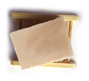 rose geranium and shea butter soap on a bamboo soap saver
